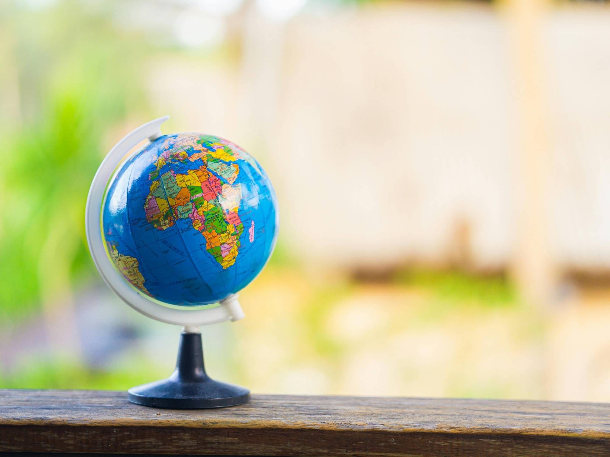 Colourful World Globe on Wooden Surface